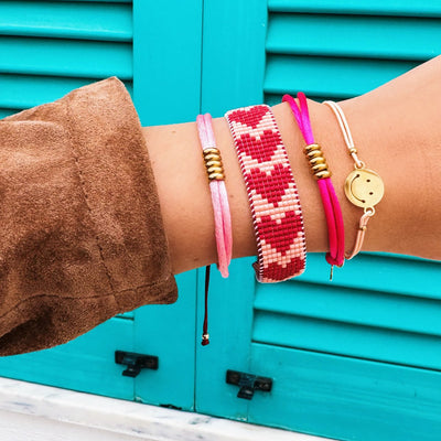 Elastisches Armband mit Smiley - pfirsich/gold