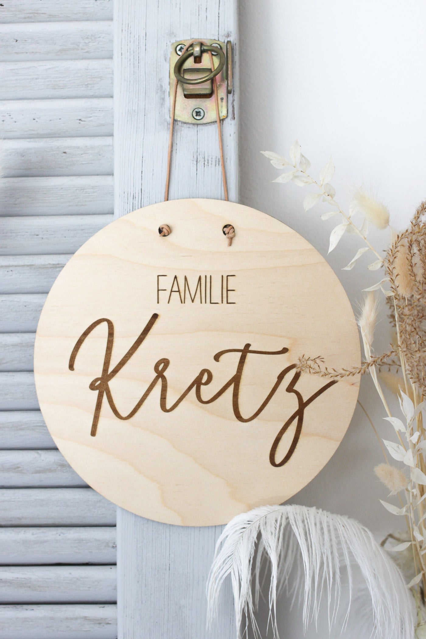 Holzschild mit Namensgravur "Familie ..."